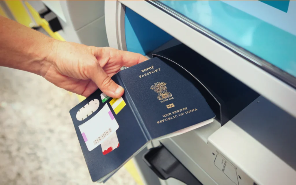 A new Indian e-passport held in hand in the UAE, showing the gold chip symbol on the cover