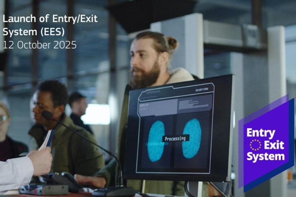 UAE passport holder at European airport immigration counter with biometric scanning equipment for Schengen Entry-Exit System