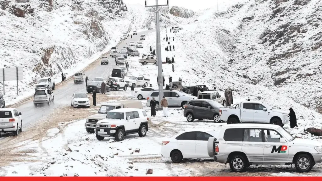 Tourist and residents on the snow roads of saudi arabia
