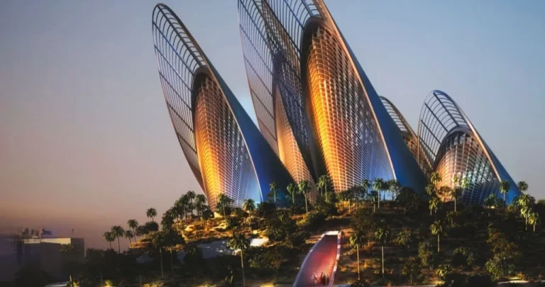The exterior of the Zayed National Museum on Saadiyat Island, featuring five steel towers shaped like falcon wings.