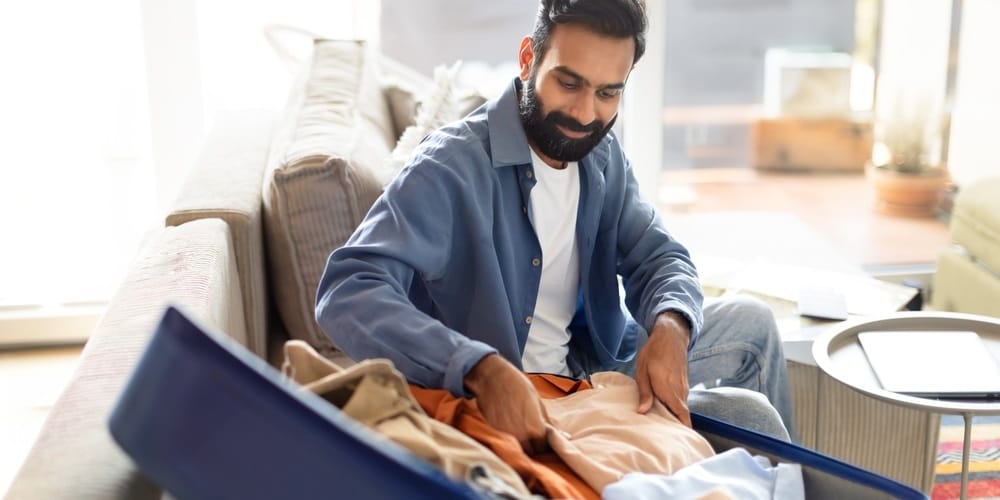 Happy UAE and Indian family at the airport benefiting from the Air India Express AED 2 baggage offer.