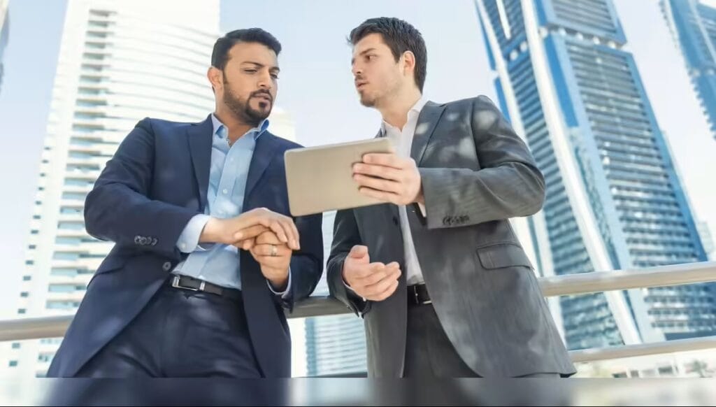 Bank officials discussing mortgage options for the Dubai First-Time Home Buyer Program