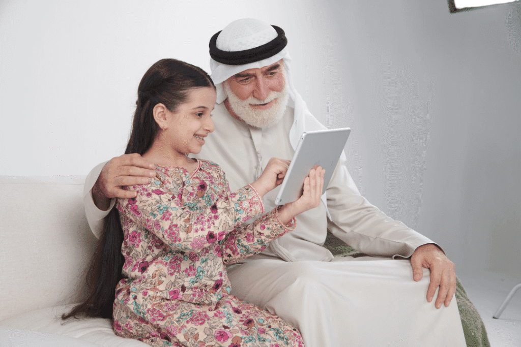 Residents using Digital tablet displaying the FTA Labaih initiative portal for tax compliance.