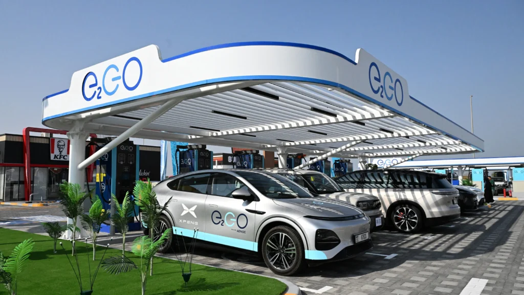 Electric vehicles plugged into the ADNOC superfast EV charging hub at Saih Shuaib.