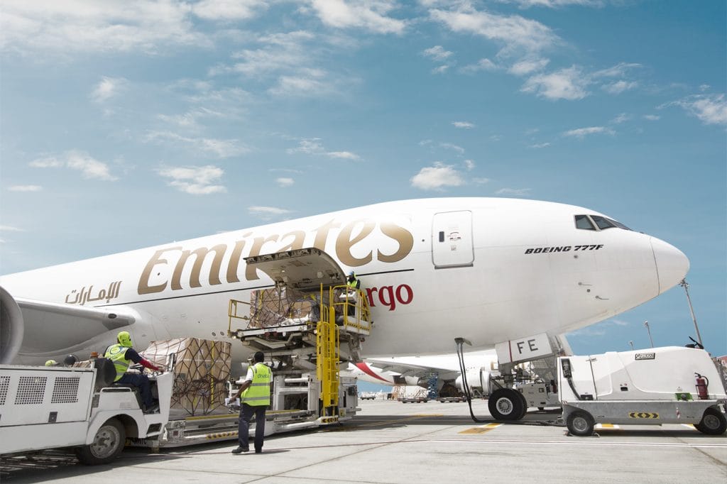Cargo crew loading temperature-controlled pharma shipments aligning with the Emirates SkyCargo 2026 strategy.