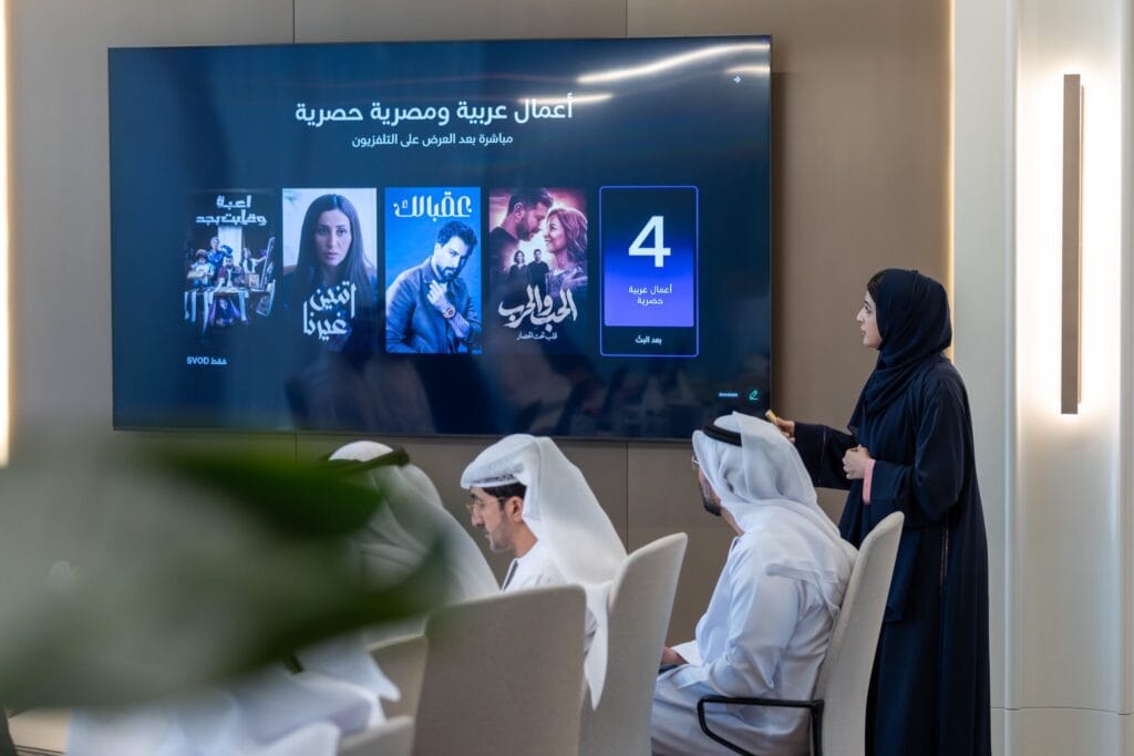 The Dubai+ digital media platform logo displayed at a press conference in Dubai.