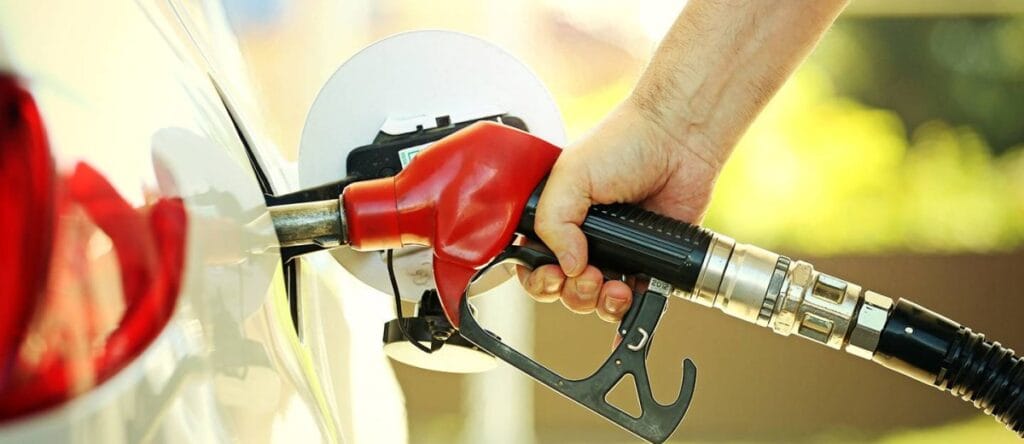 Motorist refueling a car following the drop in UAE fuel prices February 2026.