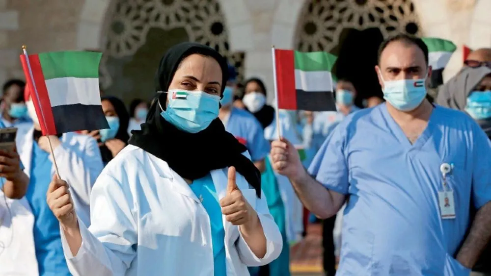 Nurses and doctors celebrating the new UAE healthcare workers reward initiative.
