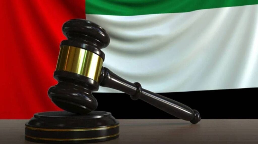 A wooden gavel resting on legal documents representing the new UAE civil law update 2026 regarding expat inheritance.