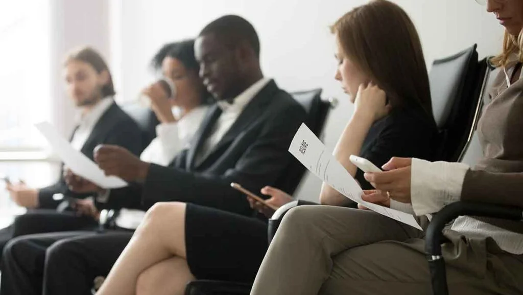 Graduate attending a career fair to explore entry-level roles in the UAE job market 2025.
