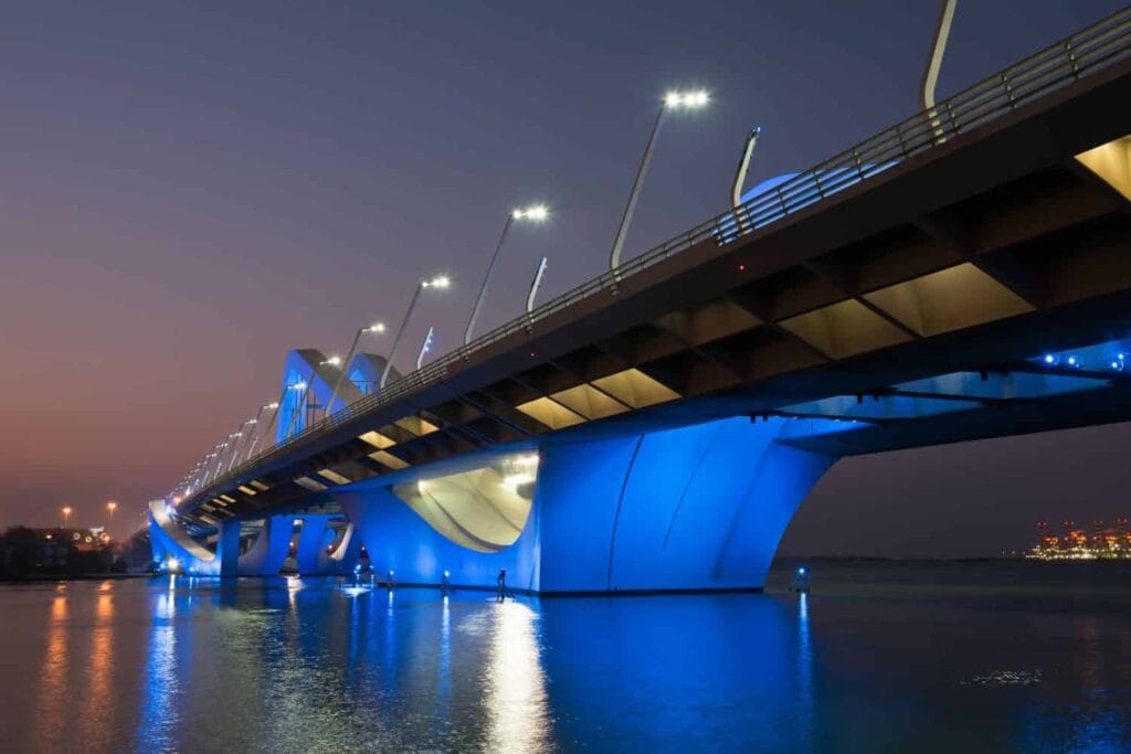 Modern architectural design of smart lighting Abu Dhabi bridges at Abu Dhabi University crossing.
