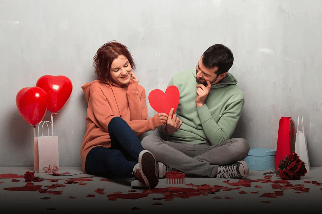 Romantic couple holding hands with Valentine's Day wishes and quotes text overlay