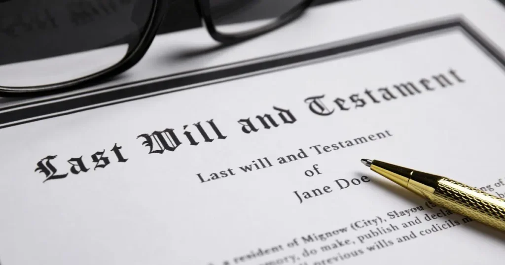 A printed copy of Non-Muslim expat wills UAE document with a gold
pen.