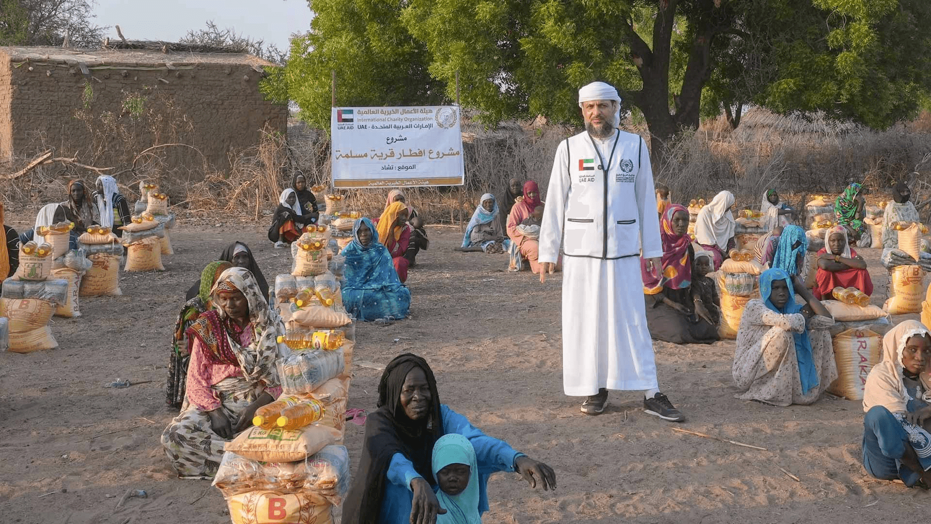 Volunteers serving Sharjah Charity International iftar meals at Ramadan tent